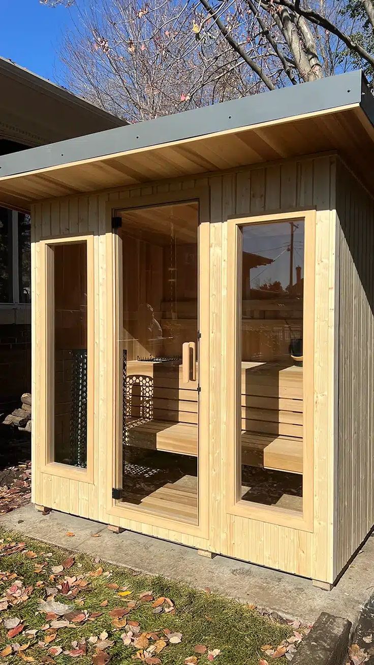 Modern outdoor sauna with glass doors