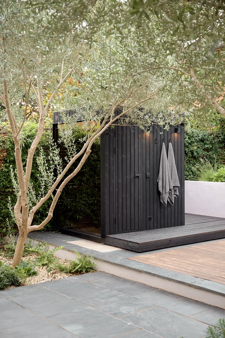 Sauna integrated into landscaped backyard